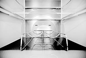 Wine bottle holders in the cold storage compartment. An empty refrigerator. Inside an empty, clean refrigerator, a