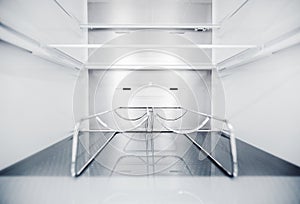 Wine bottle holders in the cold storage compartment. An empty refrigerator. Inside an empty, clean refrigerator, a