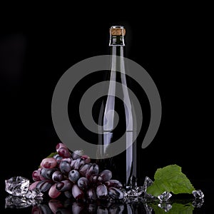 Wine bottle with red grape