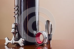 Wine bottle, stopper and a corkscrew