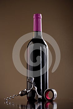 Wine bottle, stopper and a corkscrew
