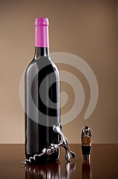 Wine bottle, stopper and a corkscrew