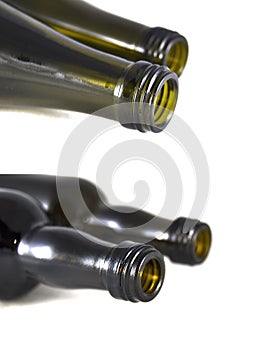 Wine bottle on white background close-up. Glass, vessel, neck, wallpaper, background, texture, alcoholism