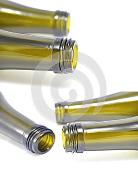 Wine bottle on white background close-up. Glass, vessel, neck, wallpaper, background, texture, alcoholism