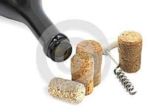 Wine bottle, wine  corkscrew and wine corks as wine still life on white background close up