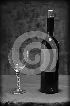 Wine bottle with wine glass