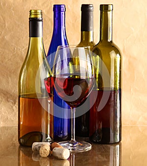 Wine bottle and wine glass on a glass table