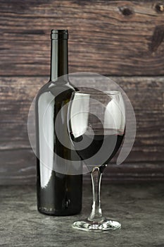 Wine bottle with wineglass corckscrew rustic wooden board, copy space