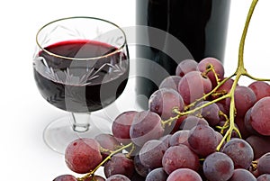 Wine bottle and wineglass with grape