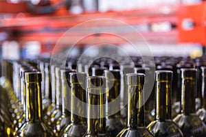 Wine bottles background, winemaking process, preparing wine for bottling in a winery