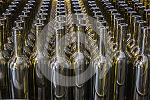 Wine bottles background, winemaking process, preparing wine for bottling in a winery