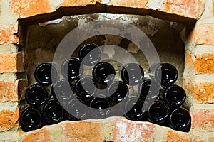 Wine bottles in the brick shelf