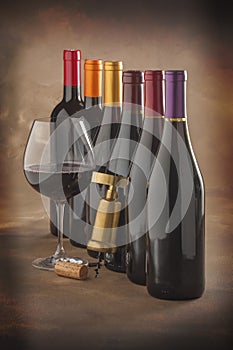 Wine bottles, glass and corkscrew