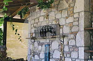 Wine bottles and glasses with baskets of grapes