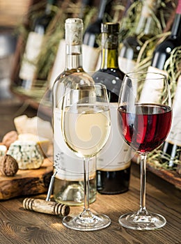 Wine bottles on the wooden shelf.