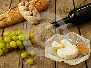 Wine, bread, cheese and grapes