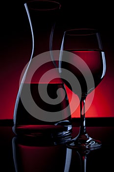 Wine Carafe and Glass on Red photo