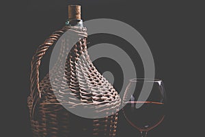 Wine carboy and wine glass