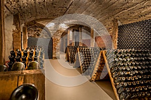 Wine cellar, a row of champagne bottles photo