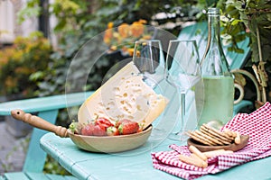 Wine and Cheese. Romantic Lunch Outdoor. Pouring Wine close-up. Outdoors. Copy cpace