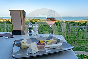 Wine, cheese table over the Lake Balaton on the hill Dinner, lunch, romantic date, picnic, eating on nature. Csopak wine