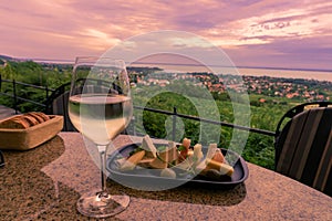 Wine, cheese table over the Lake Balaton on the hill Dinner, lunch, romantic date, picnic, eating on nature. Csopak wine