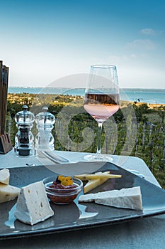 Wine, cheese table over the Lake Balaton on the hill Dinner, lunch, romantic date, picnic, eating on nature. Csopak wine