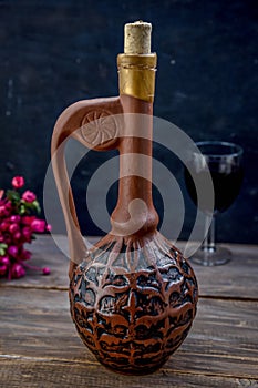 Wine in a clay pitcher .