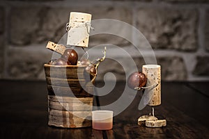 Wine cork figures, Concept two men squeezing grape juice