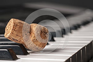 Wine cork on piano keyboard