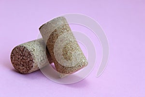 Wine cork two pieces on a pink background