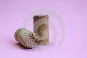 Wine cork two pieces on a pink background