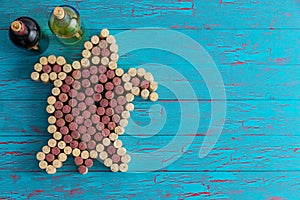 Wine corks arranged as a sea turtle on blue