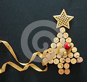Wine corks christmas tree, festive decoration, black background