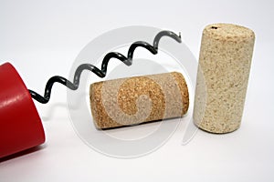 Wine corks and corkscrew isolated on a white background