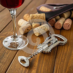 Wine Corks and Corkscrew on Wooden Table