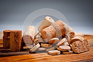 Wine corks of different sizes on the chopping board