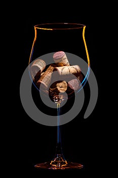 wine corks in a glass on a black background1