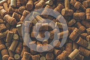 Wine corks grape shape and vine on stone table. Top view with copy space for your text.