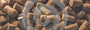 Wine corks grape shape and vine on stone table. Top view with copy space for your text.