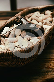 wine corks in a old basket bread on rosewood timber