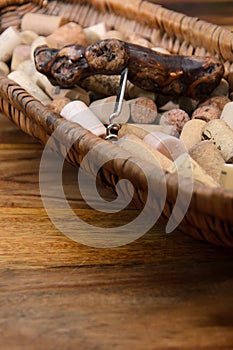 wine corks in a old basket bread on rosewood timber