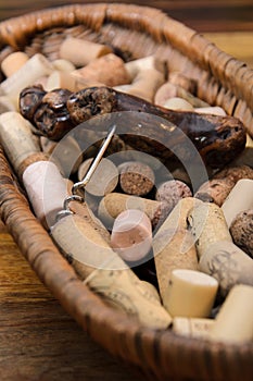 wine corks in a old basket bread on rosewood timber