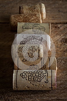Wine corks on wooden background, selective focus point