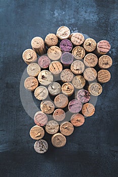 Wine corps on the grey beton background with a wine glass