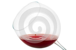 Wine drop splashing on glass