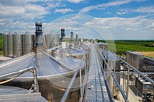 Wine fermentation tanks in winery
