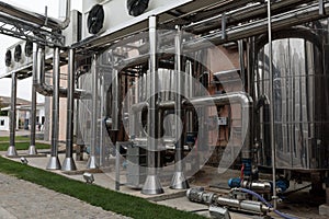 Wine Fermenting in huge vats. modern wine production plant