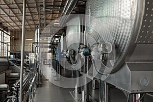 Wine Fermenting in huge vats. modern wine production plant