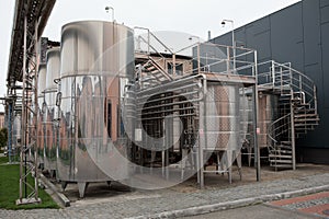 Wine Fermenting in huge vats. modern wine production plant